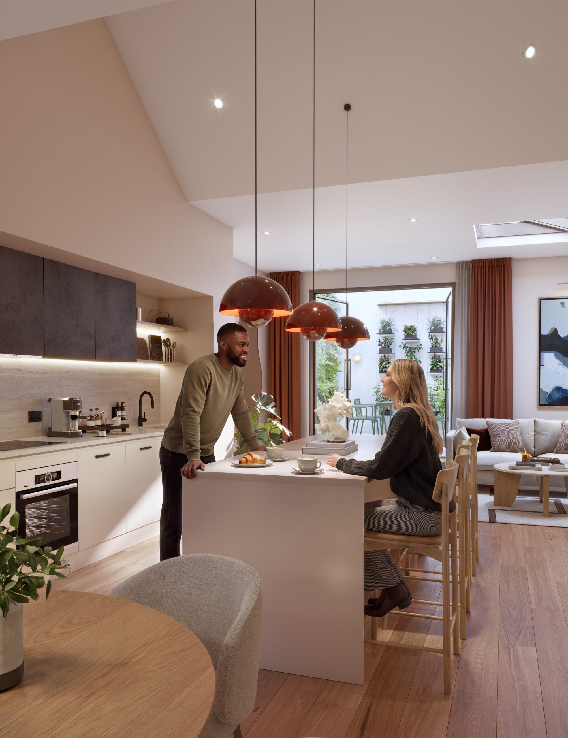 Peeler's Yard, kitchen and island area with women and man talking across island