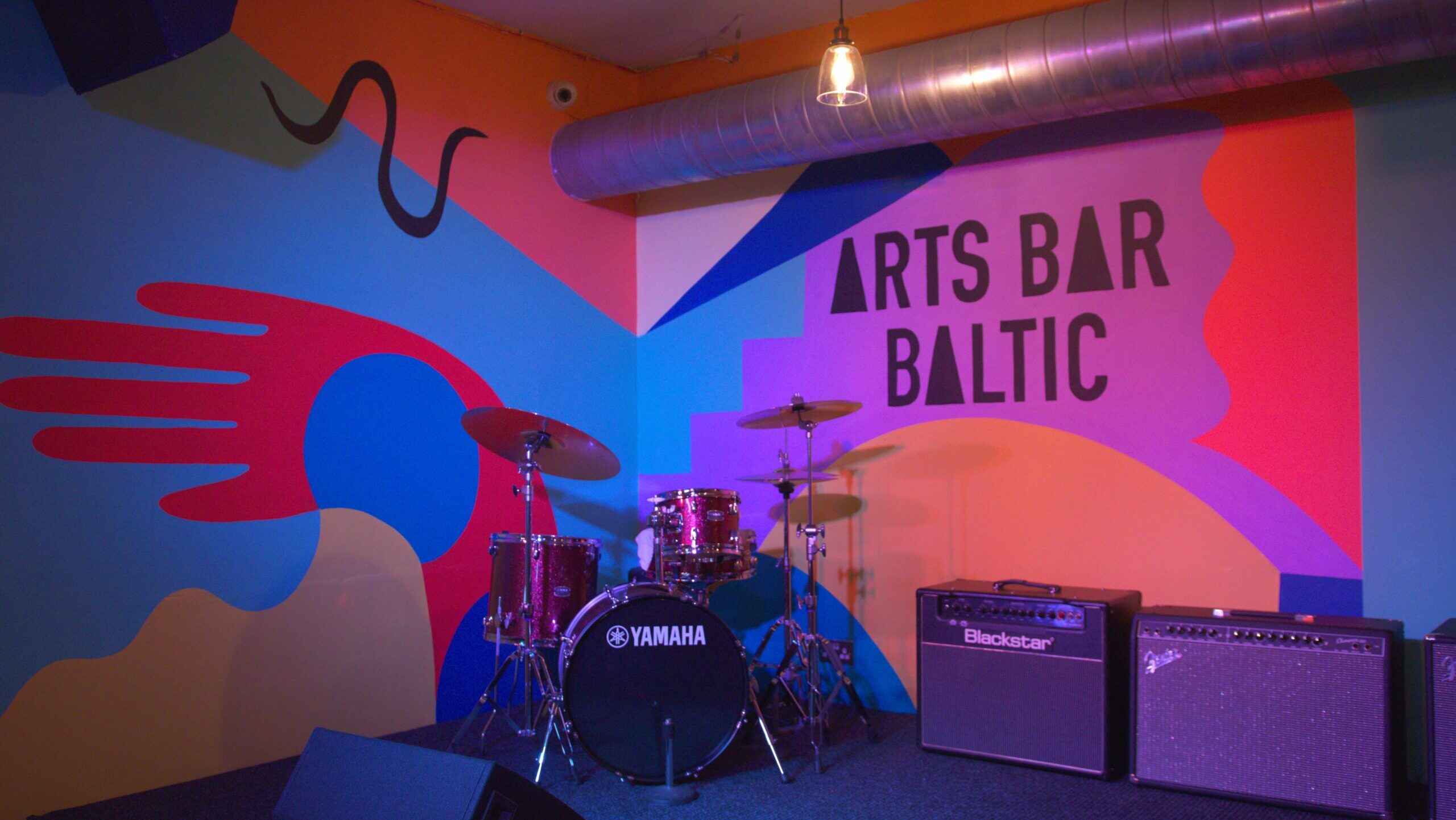 Stage with drum kit inside Arts Bar Baltic at Elevator Studios Liverpool