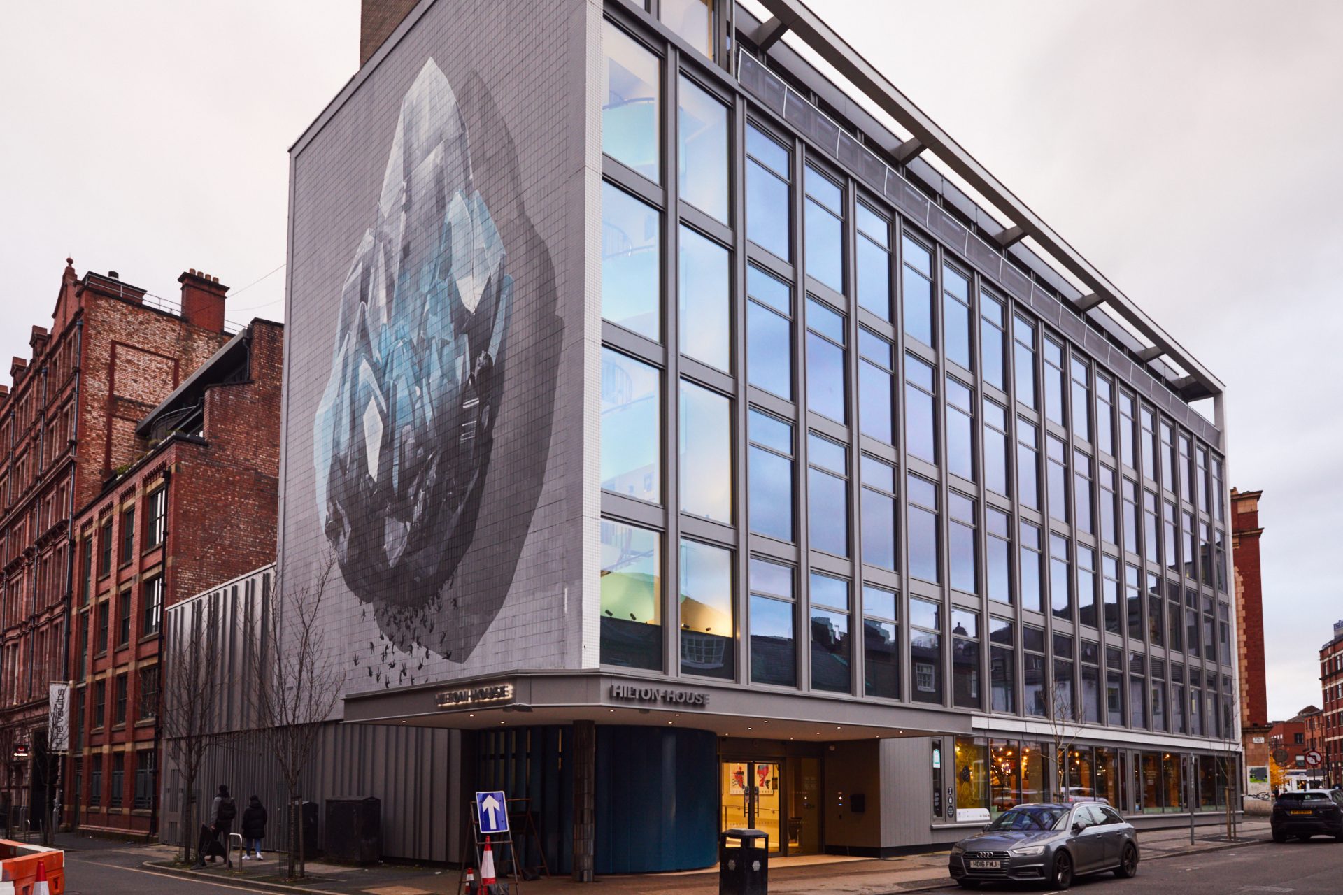 http://External%20of%20Hilton%20House%20in%20Manchester's%20Northern%20Quarter%20showing%20a%20mural%20on%20the%20side%20of%20the%20building